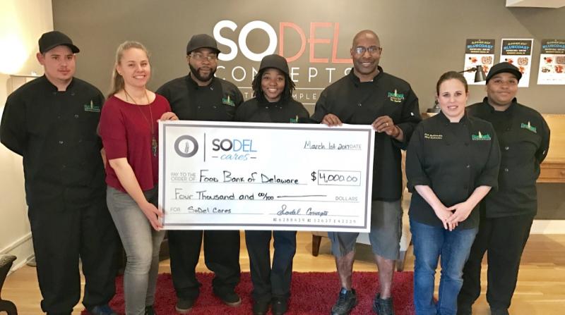 SoDel Cares, a charitable foundation founded by SoDel Concepts, recently donated $4,000 to the Food Bank of Delaware. Shown are (l-r) John Hensley, student; Lindsey Barry, controller for SoDel Concepts; DaShawn Jones, student; Anitra Hughes, student; Tim Hunter, Food Bank of Delaware executive chef; Chef Tish Badamshin, instructor; and Joyce Stevens, student. SUBMITTED PHOTO